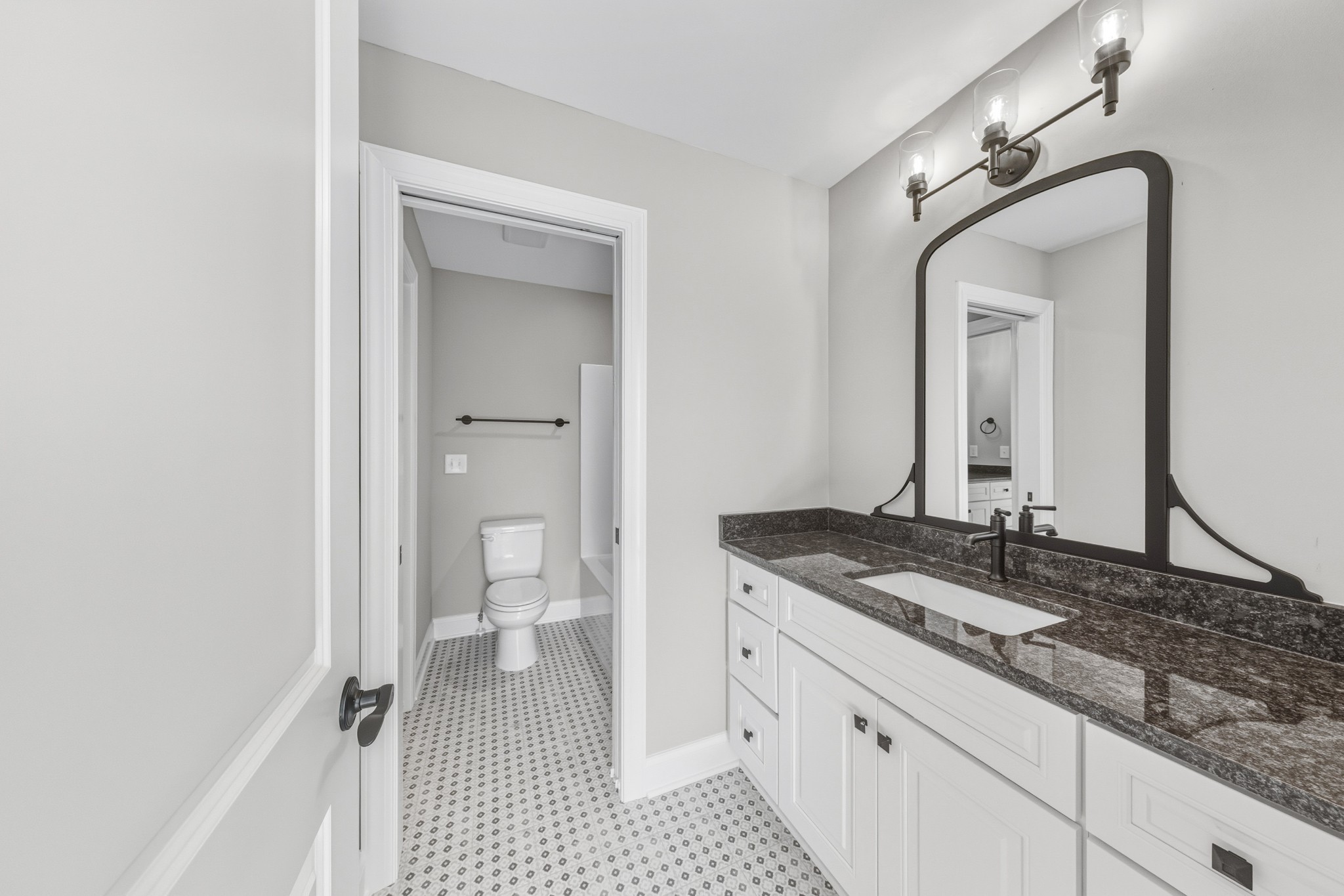 1675 Sulphur College Road Hartsville, TN 37074 - Photo 34 of 42 a bathroom with a granite countertop sink mirror and a toilet