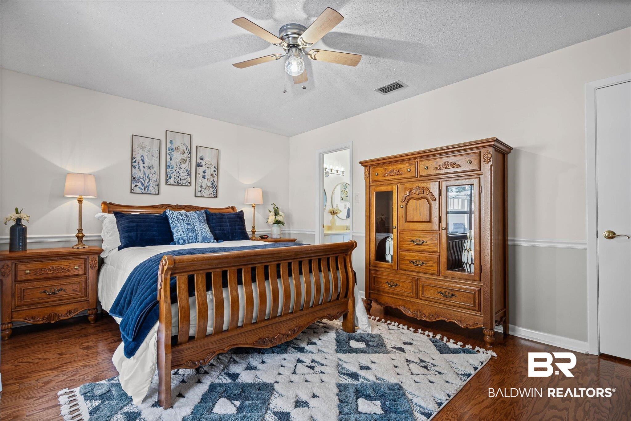4567 Pine Avenue Saraland, AL 36571 - Photo 15 of 48 Bedroom with ceiling fan, wood finished floors, and ensuite bathroom