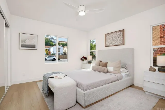 a bedroom with bed and a night stand