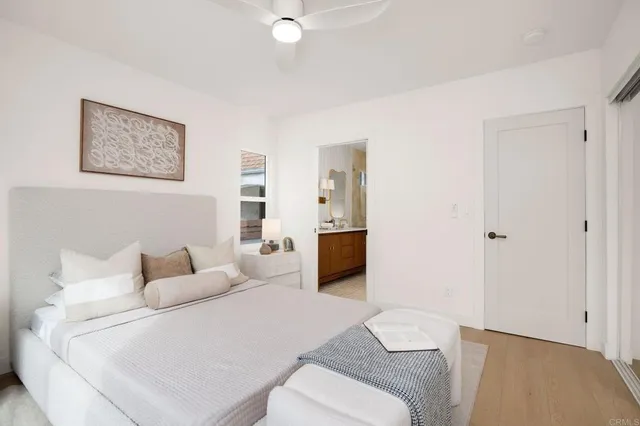 a bedroom with a bed and a couch