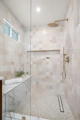 a bathroom with a shower and a sink