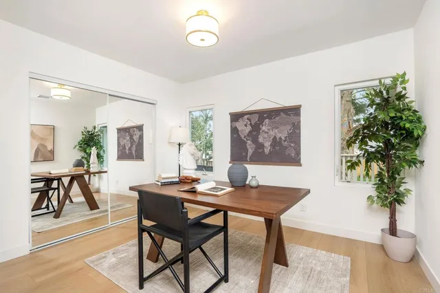 a dining room with furniture and window