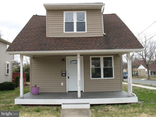 a front view of a house with yard