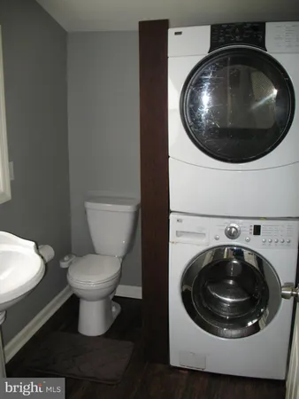 a bathroom with a toilet and a sink