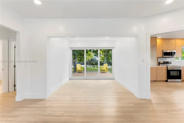 a view of a kitchen with a sink and a window