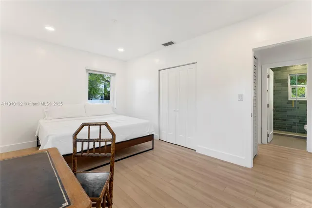 a view of a livingroom with furniture and staircase