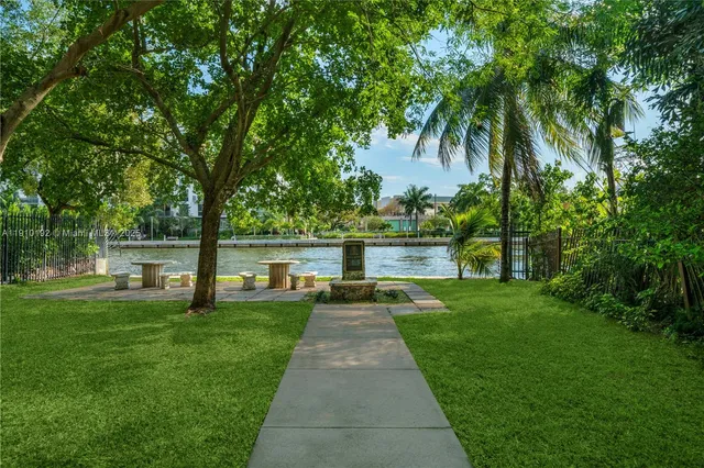 a view of a lake with a house in the background