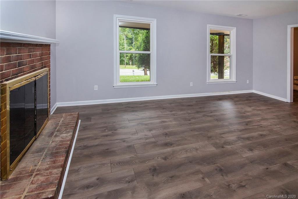 5720 Lawrence Orr Road Charlotte, NC 28212 - Photo 4 of 19 an empty room with windows