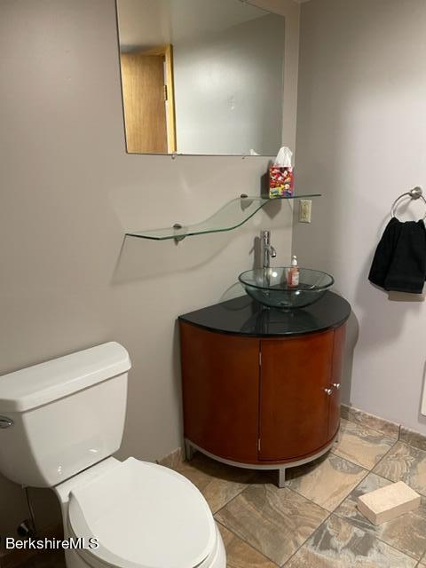76 Louden Bethlehem Road Otis, MA 01253 - Photo 20 of 54 a table with a toilet and a mirror