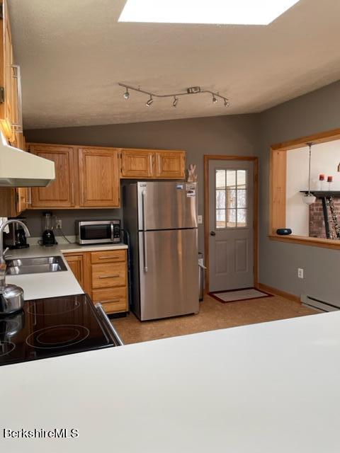 76 Louden Bethlehem Road Otis, MA 01253 - Photo 28 of 54 a kitchen with stainless steel appliances a refrigerator a sink a stove and cabinets