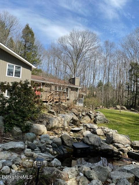 76 Louden Bethlehem Road Otis, MA 01253 - Photo 3 of 54 a view of a town with large trees