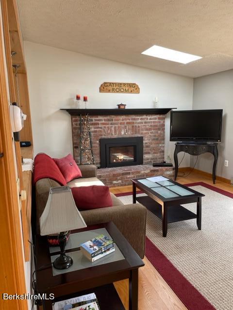 76 Louden Bethlehem Road Otis, MA 01253 - Photo 47 of 54 a living room with furniture and a fireplace
