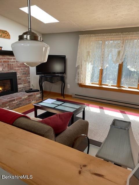 76 Louden Bethlehem Road Otis, MA 01253 - Photo 49 of 54 a living room with furniture and a fireplace