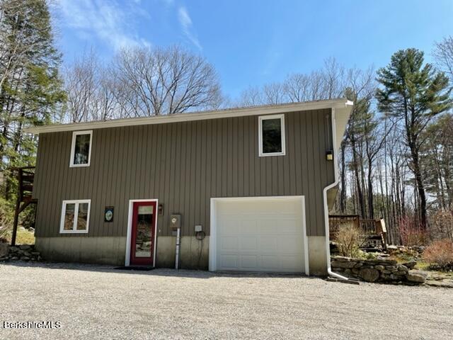 76 Louden Bethlehem Road Otis, MA 01253 - Photo 5 of 54 a front view of a house with a yard
