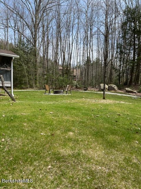 76 Louden Bethlehem Road Otis, MA 01253 - Photo 8 of 54 a backyard of apartments with large trees