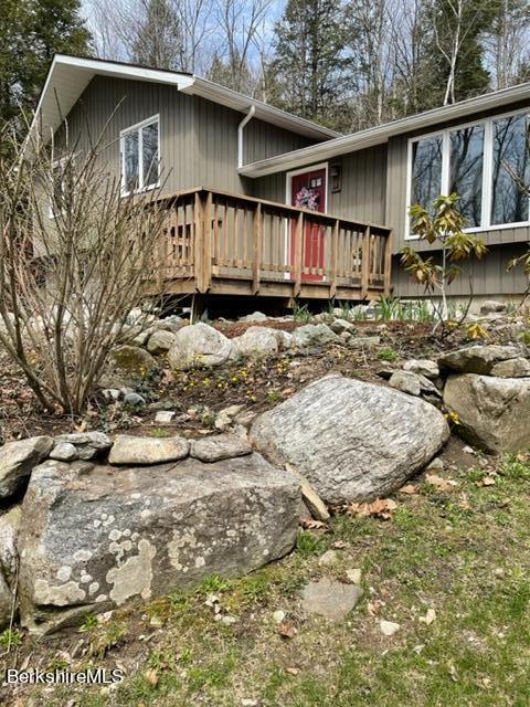 76 Louden Bethlehem Road Otis, MA 01253 - Photo 9 of 54 a view of a house with wooden fence