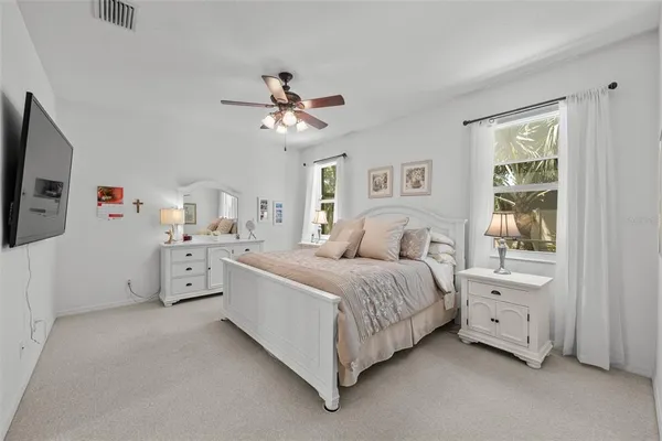 a bed room with a bed and a tv