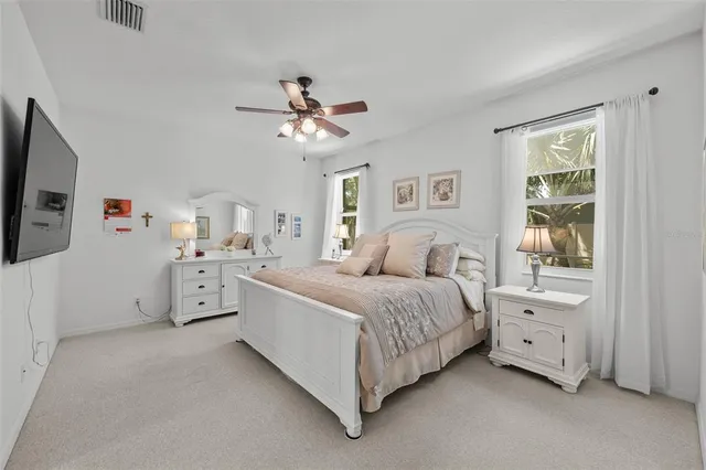 a bed room with a bed and a tv