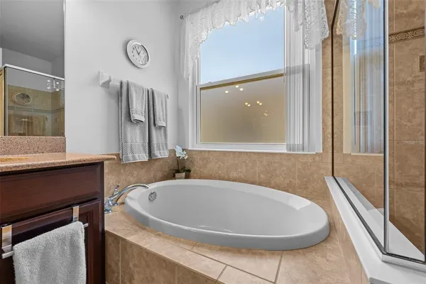 a bathroom with a bathtub and a sink