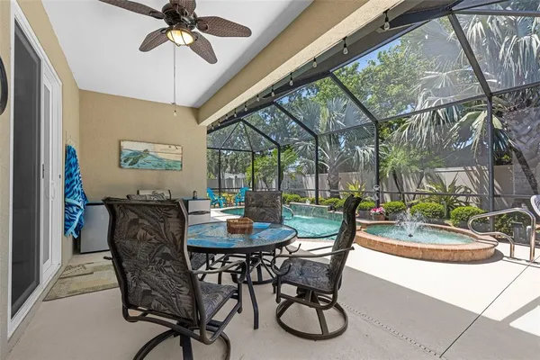 a dining room with furniture a chandelier and a rug