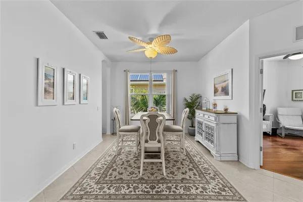 a dining room with furniture and window