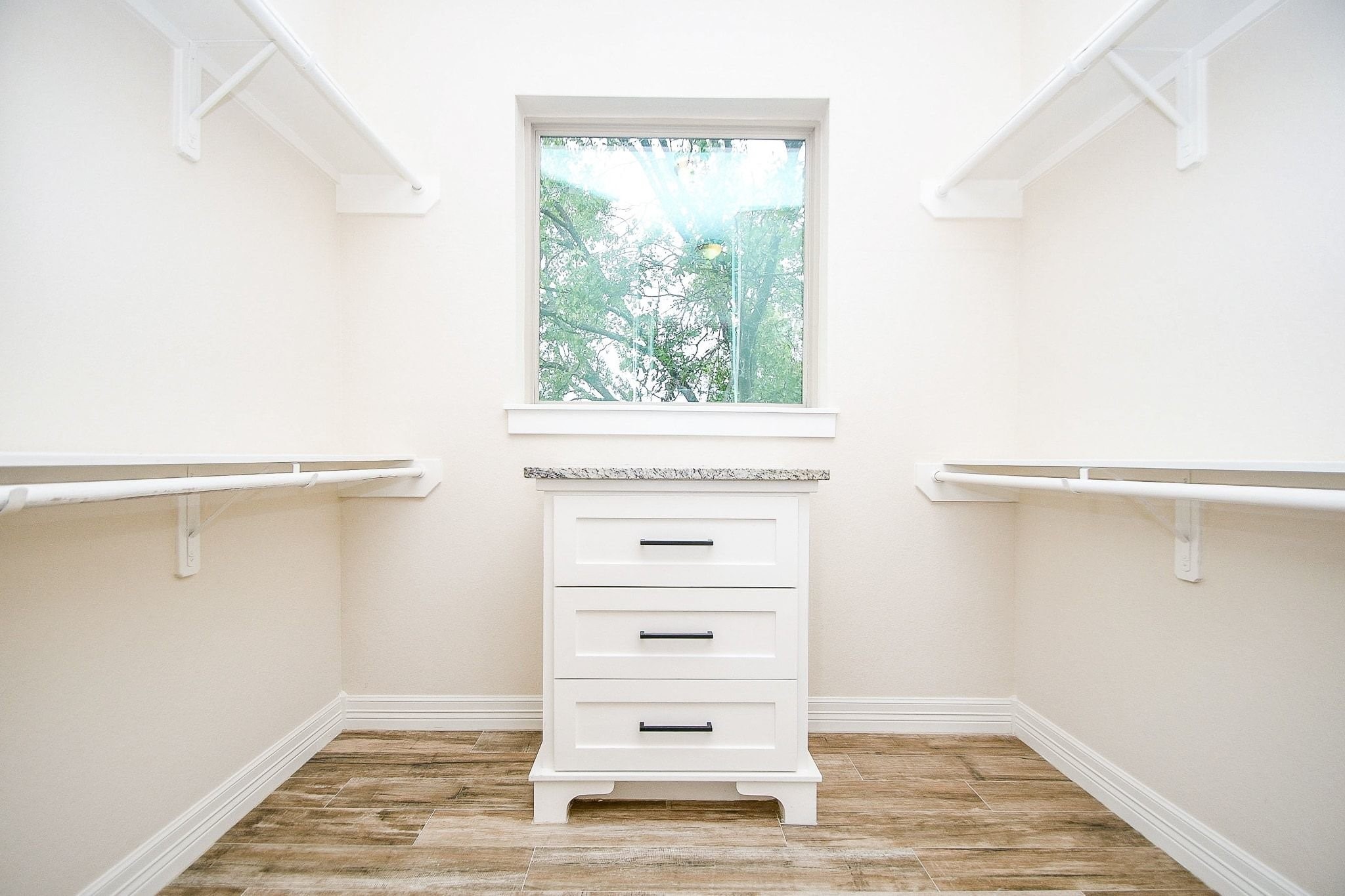 710 Stanford Street, Unit B Houston, TX 77019 - Photo 23 of 33 a view of a closet with wooden floor