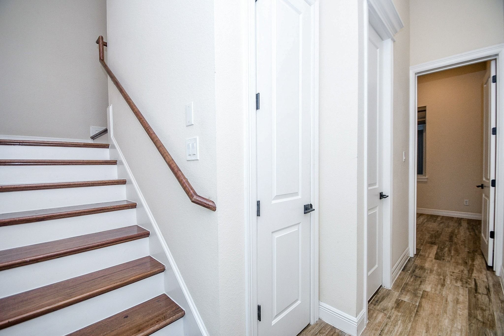 710 Stanford Street, Unit B Houston, TX 77019 - Photo 6 of 33 a view of entryway with wooden floor and stairs