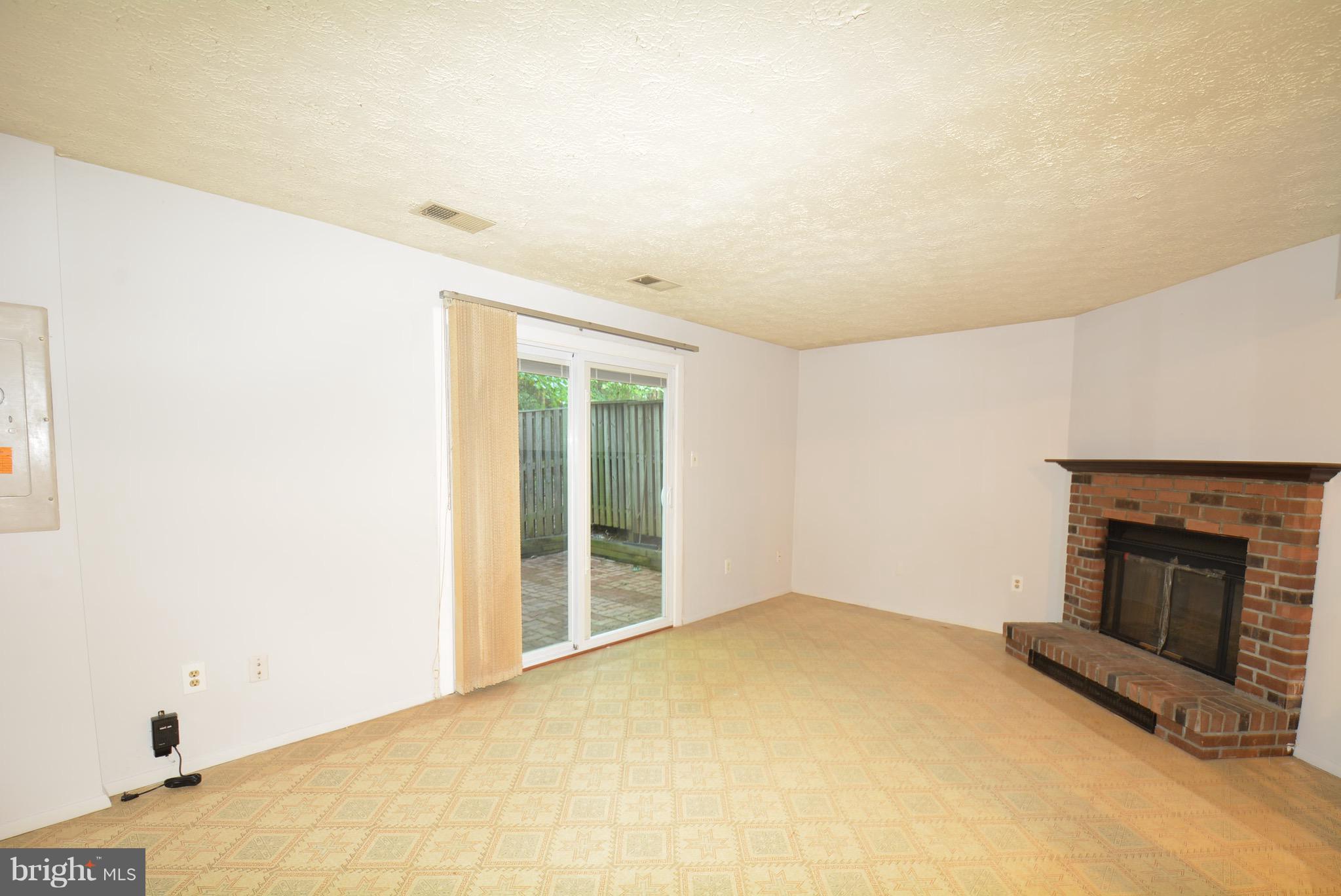 11555 Underoak Court Reston, VA 20191 - Photo 15 of 22 Rec Room with Wood Fireplace