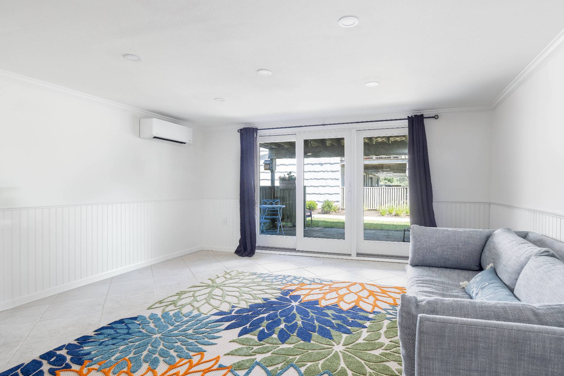 3045 Mitchell Road Westhampton Beach, NY 11978 - Photo 13 of 25 a living room with a couch and next to a window