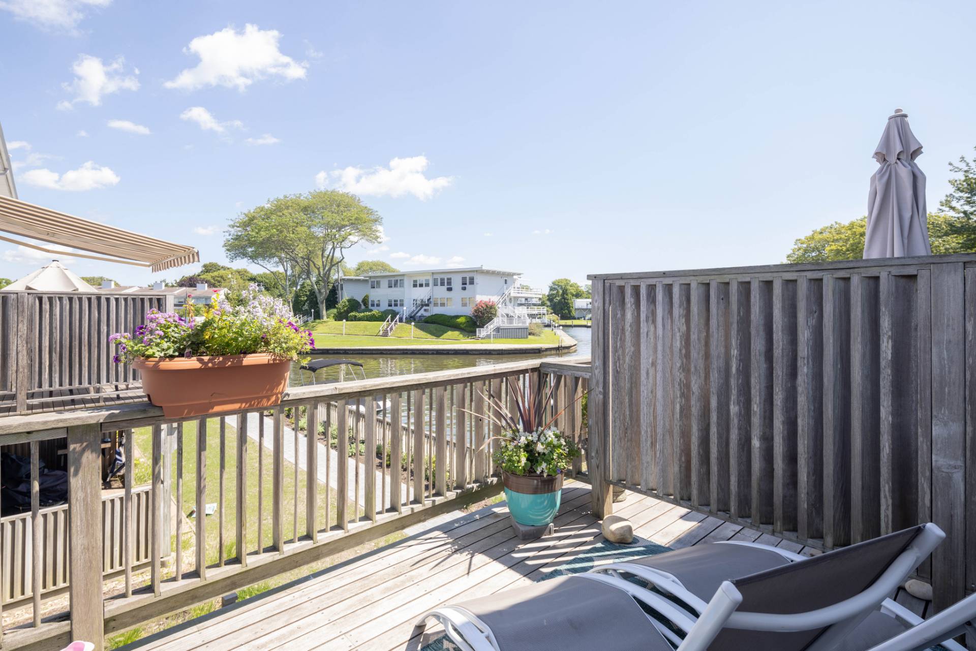 3045 Mitchell Road Westhampton Beach, NY 11978 - Photo 19 of 25 a view of a balcony with furniture