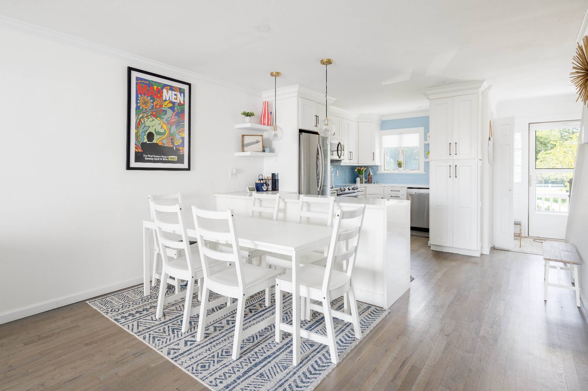 3045 Mitchell Road Westhampton Beach, NY 11978 - Photo 4 of 25 a view of a dining room with furniture and wooden floor