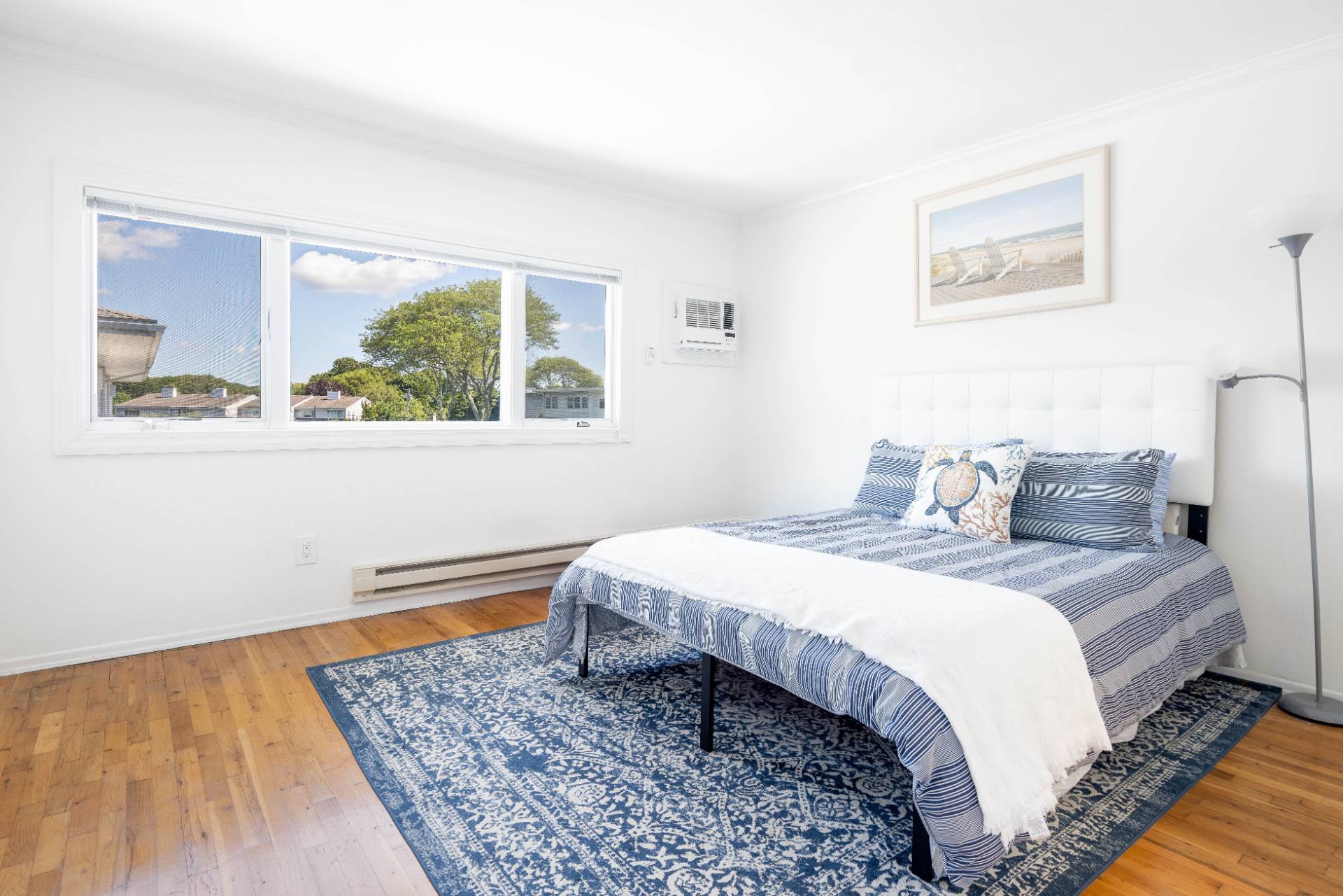 3045 Mitchell Road Westhampton Beach, NY 11978 - Photo 9 of 25 a bedroom with bed and a window