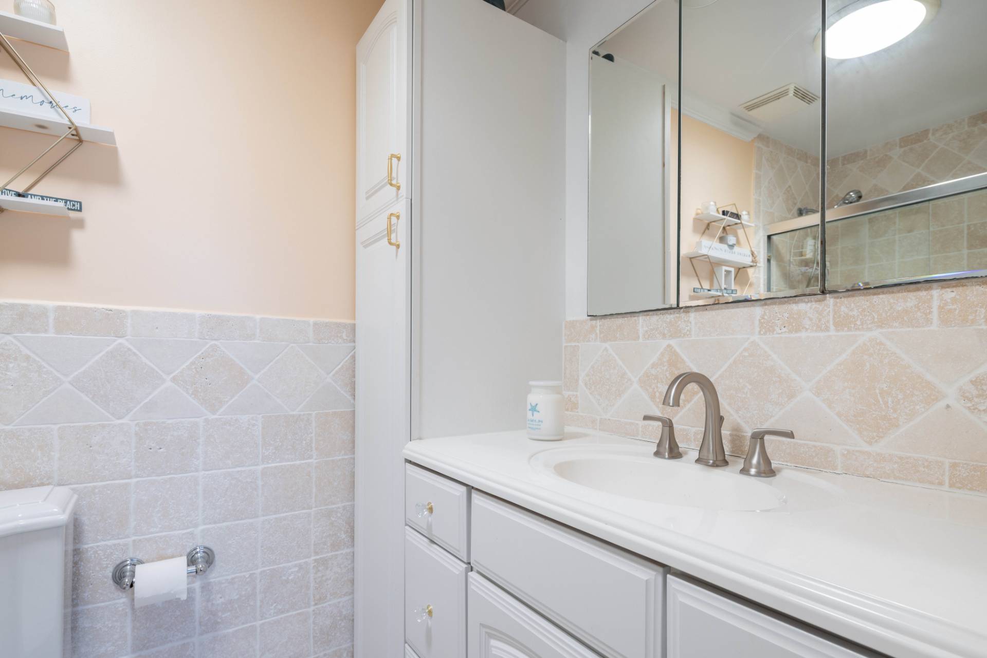 3045 Mitchell Road Westhampton Beach, NY 11978 - Photo 10 of 25 a bathroom with a sink and mirror