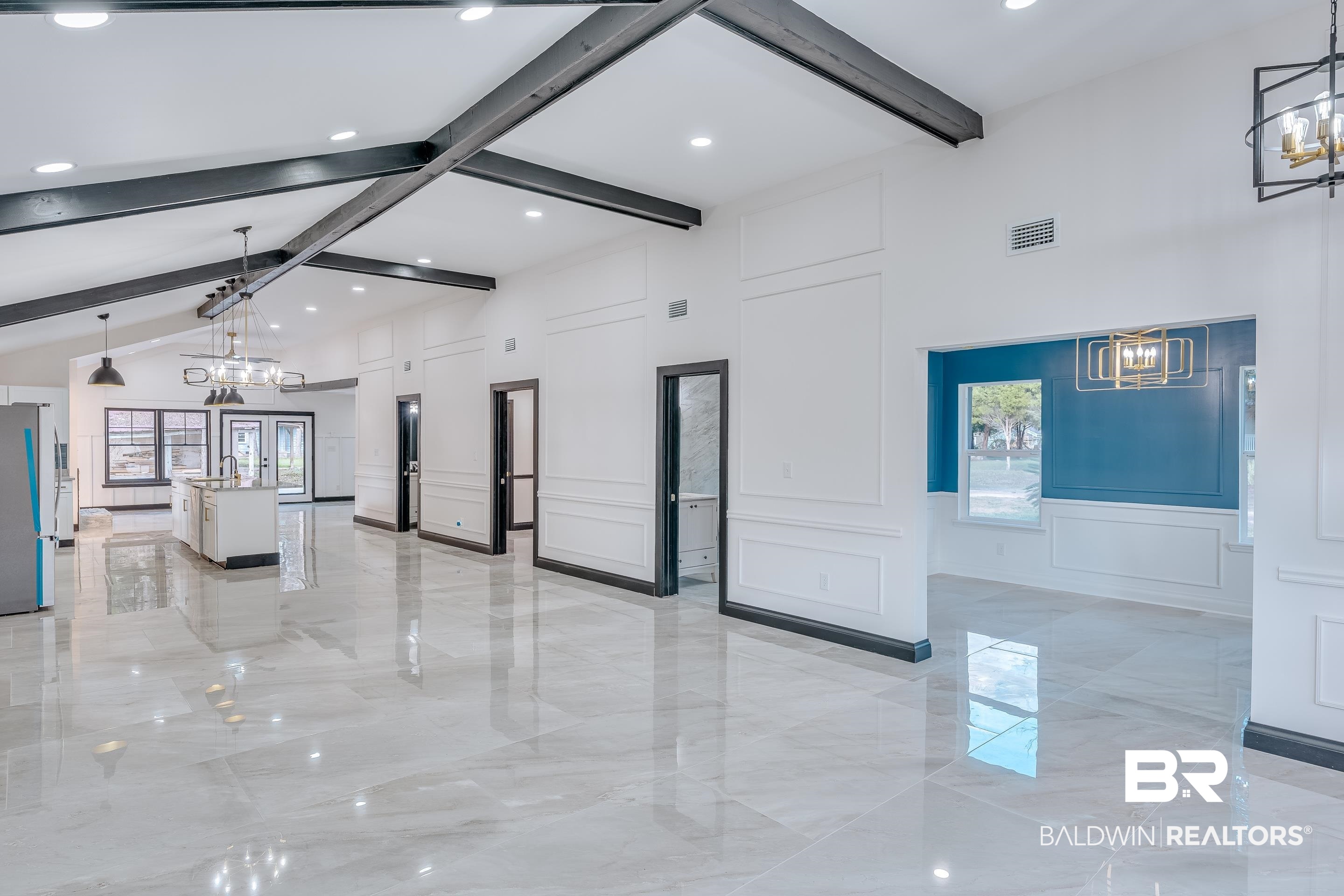 1190 Military Road Mount Vernon, AL 36560 - Photo 4 of 47 Building lobby featuring a decorative wall, beamed ceiling, and high vaulted ceiling