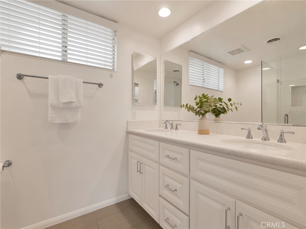22649 Town Crier Road Calabasas, CA 91302 - Photo 17 of 47 a bathroom with a sink and a mirror