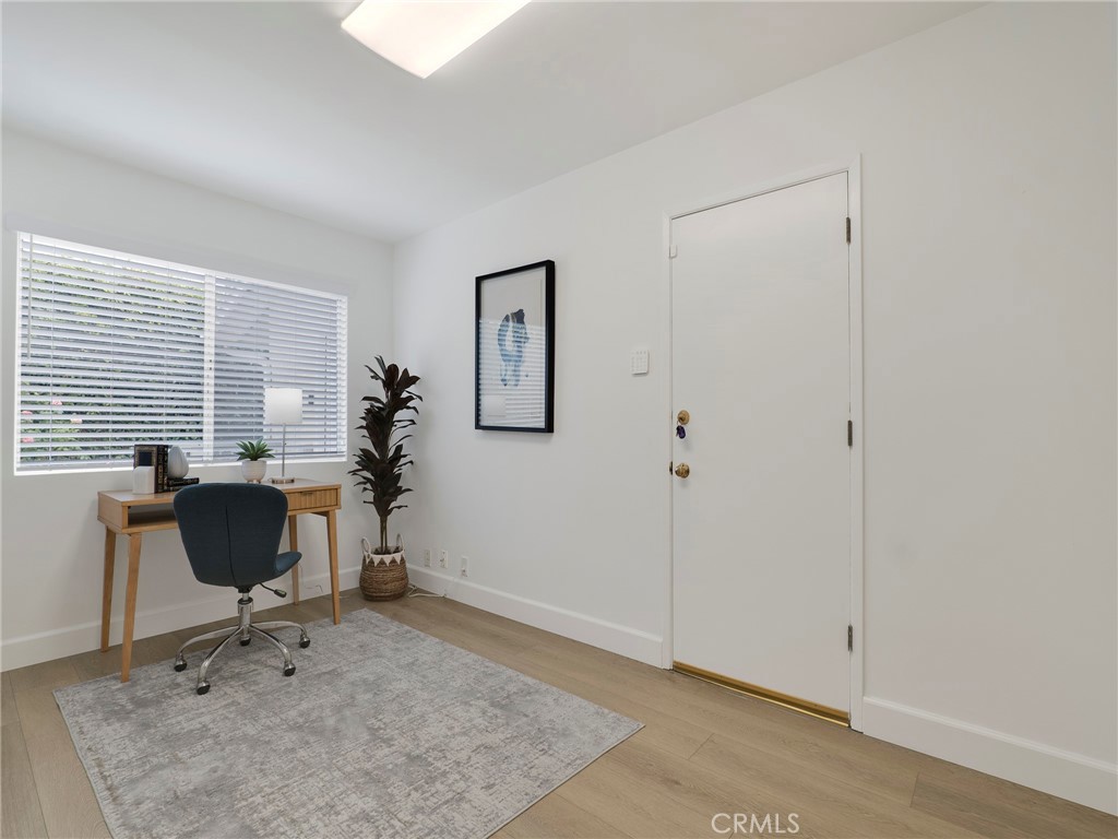 22649 Town Crier Road Calabasas, CA 91302 - Photo 19 of 47 a view of a workspace with furniture and a window