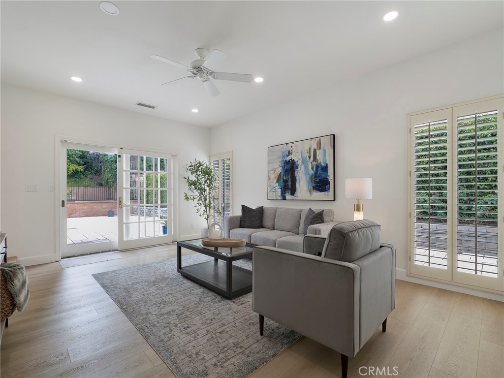 22649 Town Crier Road Calabasas, CA 91302 - Photo 21 of 47 a living room with furniture and a large window