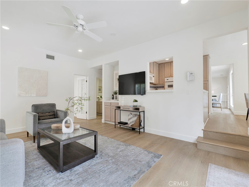 22649 Town Crier Road Calabasas, CA 91302 - Photo 24 of 47 a living room with furniture and a flat screen tv