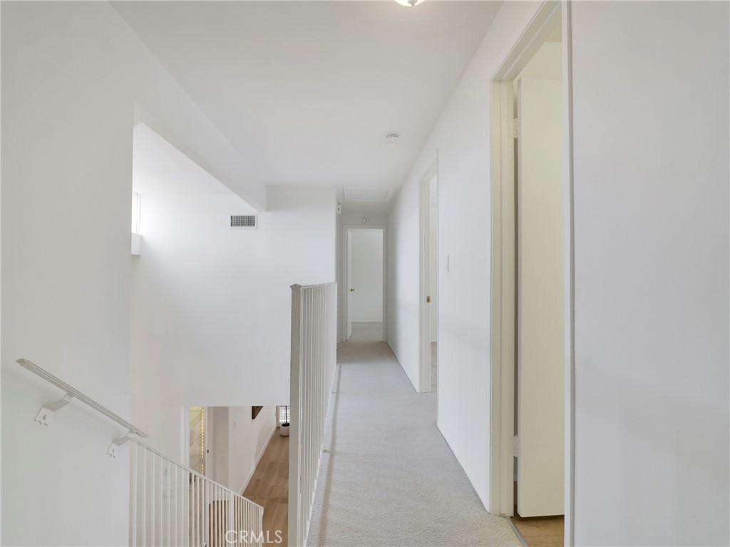 22649 Town Crier Road Calabasas, CA 91302 - Photo 32 of 47 a view of a hallway with closet