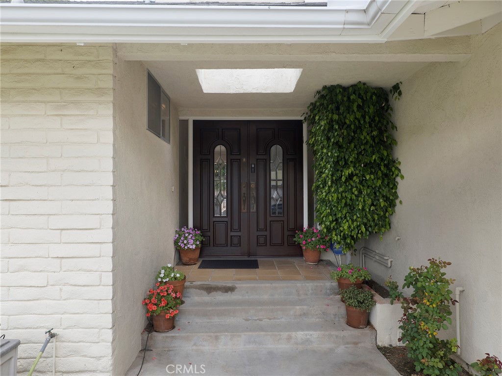 22649 Town Crier Road Calabasas, CA 91302 - Photo 4 of 47 a front view of a house