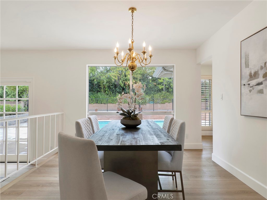 22649 Town Crier Road Calabasas, CA 91302 - Photo 6 of 47 a view of a dining room with furniture window and wooden floor