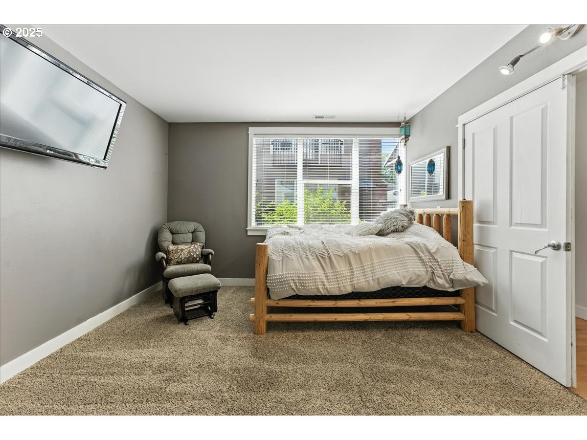 1443 Northeast Village Street Fairview, OR 97024 - Photo 23 of 37 a bedroom with bed and window