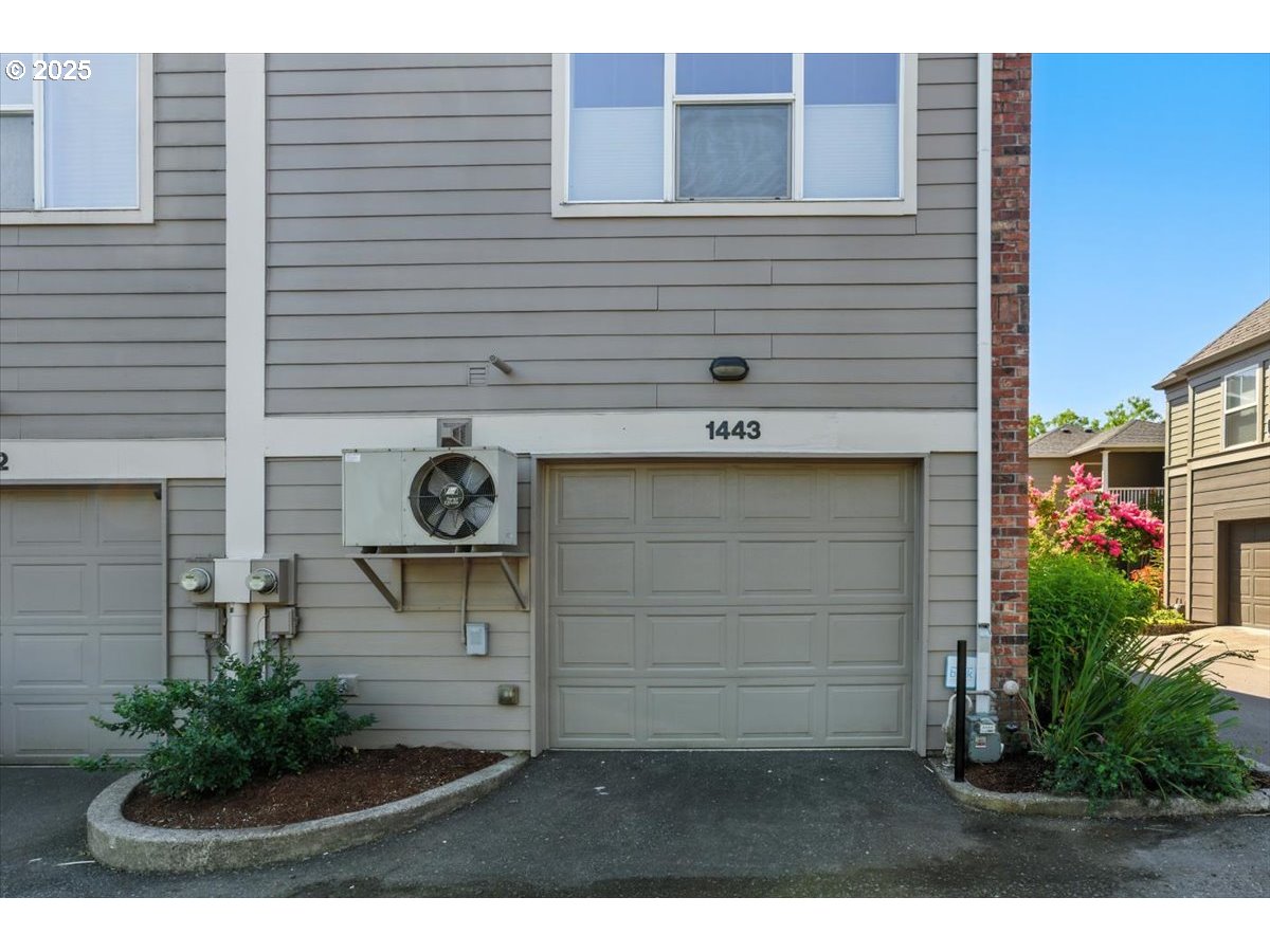 1443 Northeast Village Street Fairview, OR 97024 - Photo 32 of 37 a view of a wooden door and a tree in the background