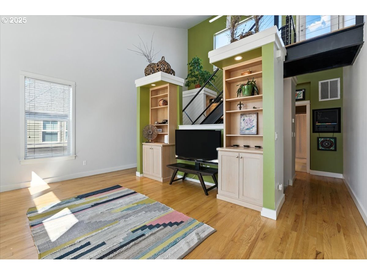1443 Northeast Village Street Fairview, OR 97024 - Photo 5 of 37 a workspace with furniture and wooden floor