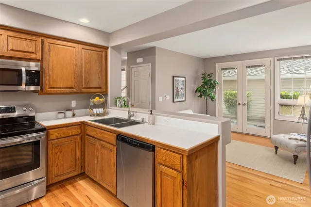 a kitchen with a sink stove and cabinets