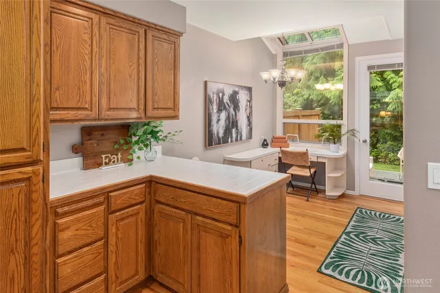 workspace with wooden floor and windows