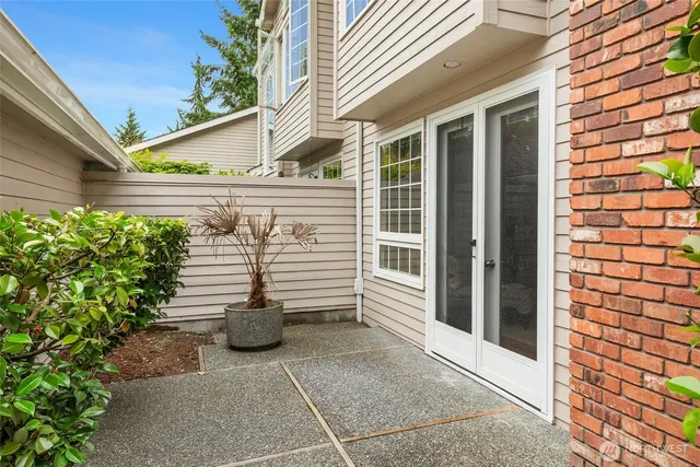 a view of a house with potted plants