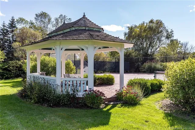 a view of a house with garden and porch