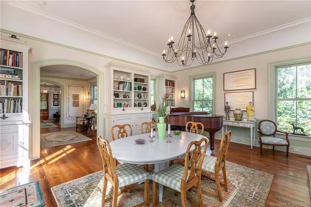 a view of a dining room with furniture window and outside view