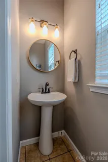 a bathroom with a sink and mirror